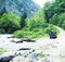 Jeep on road hight in mountain, beautiful summer landscape with river