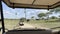 Jeep safari. View from the jeep window to a group of elephants. Tarangire National Park. Amazing landscapes of Africa