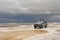 Jeep in the salt lake salar de uyuni, bolivia