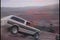Jeep speeding down dirt road