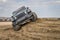 Jeep Wrangler, Rubicon model, on a muddy training drive off-road course