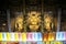 JEJU ISLAND,  SOUTH KOREA- OCTOBER 15, 2019: Golden Buddha statues inside Dharma Hall of the Yakcheonsa Temple on Jeju Island,