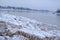 Jekabpils after the flood. River Daugava with ice piles on the banks. A dark, dreary January day