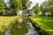 Jeker river with the water gate of the Reek in the second medieval city wall of Maastricht