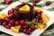 Jellied cranberry sauce with orange wedges