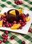 Jellied cranberry sauce with orange wedges and rosemary