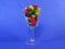 Jelly beans candy in a cup a blue background