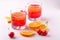 Jelly dessert with strawberries in drink glass with cherry berries and orange slices nearby