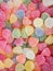Jelly Marmalade Candies of Various Colors in Shape of Gems. Vivid Multicolored Palette Orange Yellow Green Red Pink Blue. Pattern