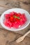 Jelly strawberry on white plate.
