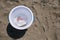 A jellyfish inside a beach bucket