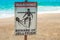 Jellyfish warning sign at beach .