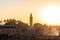 Jemaa el-Fnaa Crowded at Sunset with Koutoubia Mosque