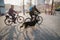 Jena, Germany. March 23 2019. Seniors riding bicycles with a big dog