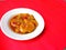 Jengkol stew, typical Indonesian food with red background, August 8, 2021