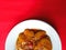 Jengkol stew, typical Indonesian food with red background, August 8, 2021