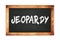 JEOPARDY text written on wooden frame school blackboard