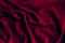 Jersey cotton fabric texture. Crumpled dark red textile background