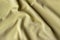 Jersey cotton fabric texture. Crumpled yellow textile background