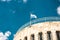 Jerusalem Historical City Hall Building, flag of Israel and blue sky. Details, toned photo