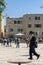 Jerusalem - Israel-12-05-2019 View from a terrace, across the square, where a Jewish orthox man with a long beard hurries