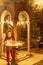 JERUSALEM, ISRAEL - April 2, 2018: woman sets candles in the Church of the Holy Sepulchre.