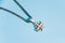 Jerusalem silver crusader cross with chain on a blue background