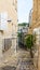 Jerusalem white stone house on narrow street of Old Yafo Jaffa. Tel Aviv, Israel.