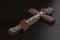 Jesus Christ Figurine Crusified On Wooden Cross On Black Backgro