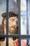 Jesus Christ head statue behind bars