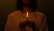 Jesus Christ holding burning candle in darkness, saint symbol of christian pray