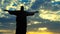 Jesus Christ redeemer statue silhouette in Rio de Janeiro Brazil against celestial sky timelapse