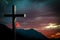 Jesus Christ wooden cross on a scene with dramatic sky and colorful sunset, sunrise.