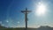 Jesus cross against blue sky, zoom out