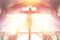 Jesus on the cross in church with ray of light from stained glass, image of the crucifixion