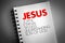 JESUS - Joyful Eternal Selfless Understanding Son of God acronym on notepad, concept background
