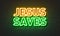 Jesus saves neon sign on brick wall background.