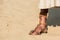 Jesus standing on wavy sand