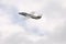 Jet aircraft in cloudy sky