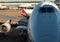 Jet aircraft docked at sydney airport , with a person loading good on the plane