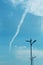 Jet airplane long smoke on the blue sky.