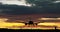 Jet airplane silhouette landing on cloudy sky