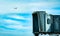 Jet bridge after commercial airline take off at the airport and the plane flying in the blue sky and white clouds. Aircraft