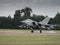 Jet fighter aircraft landing on runway