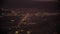 Jet plane prepare to landing in Los Angeles LAX airport at night time. Porthole view . Slow motion