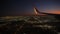 Jet plane prepare to landing in Los Angeles LAX airport. Porthole view with wing. Slow motion