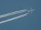 Jet plane with vapor trails