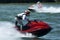 Jet Ski driver standing rides boat