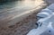 Jet ski lining up. The water sports vehicle park above the sand. Tides getting low. Pebbles and crushed corals scattering around.