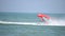 Jet ski pulling banana flying fish boat with tourists having fun on it